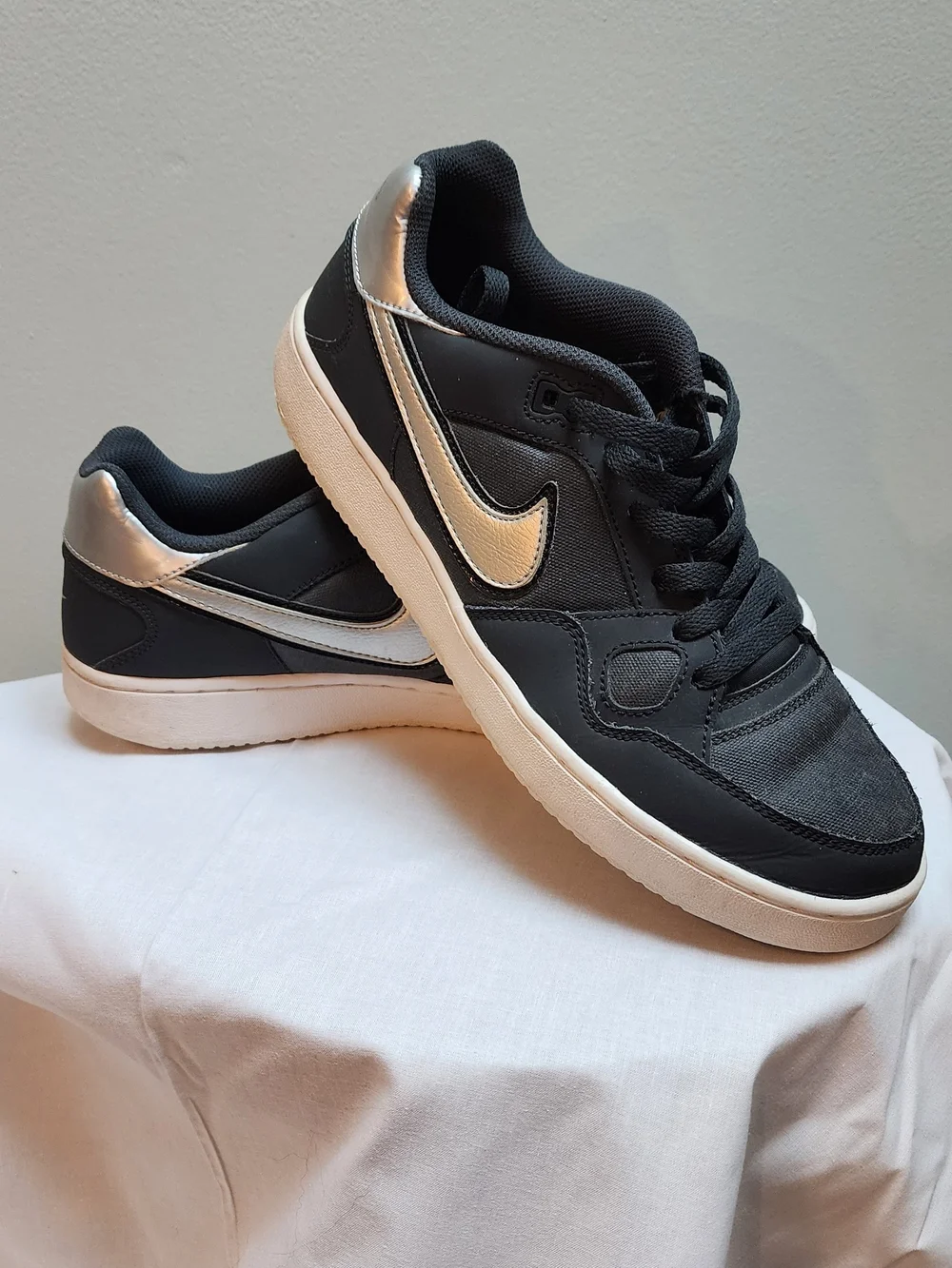 Nike Black Sneakers with Metallic Silver Swoosh and White Sole